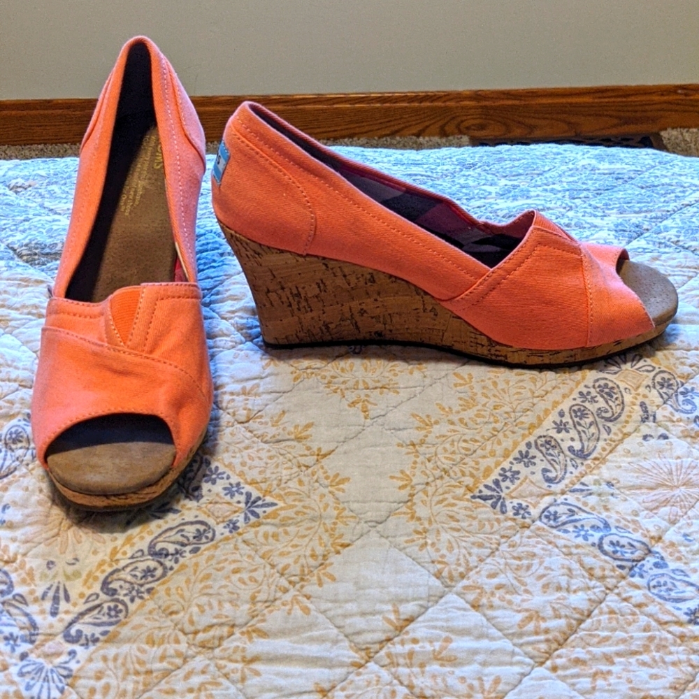 Tom's coral colored wedge sandals.